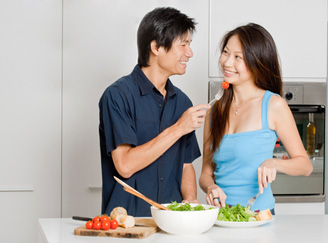 A young couple share a healthy salad