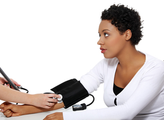 A nurse measures a patient's vitals